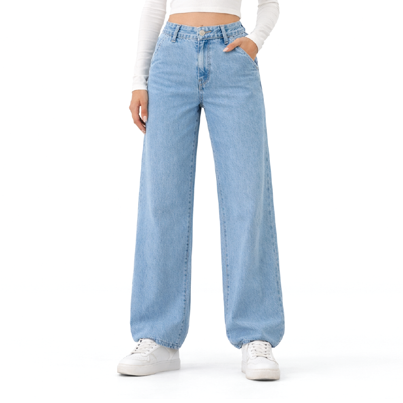 A model wearing light-wash, wide-leg denim jeans with a straight-to-relaxed leg, styled with a white ribbed long-sleeve crop top and white sneakers against a plain white background.